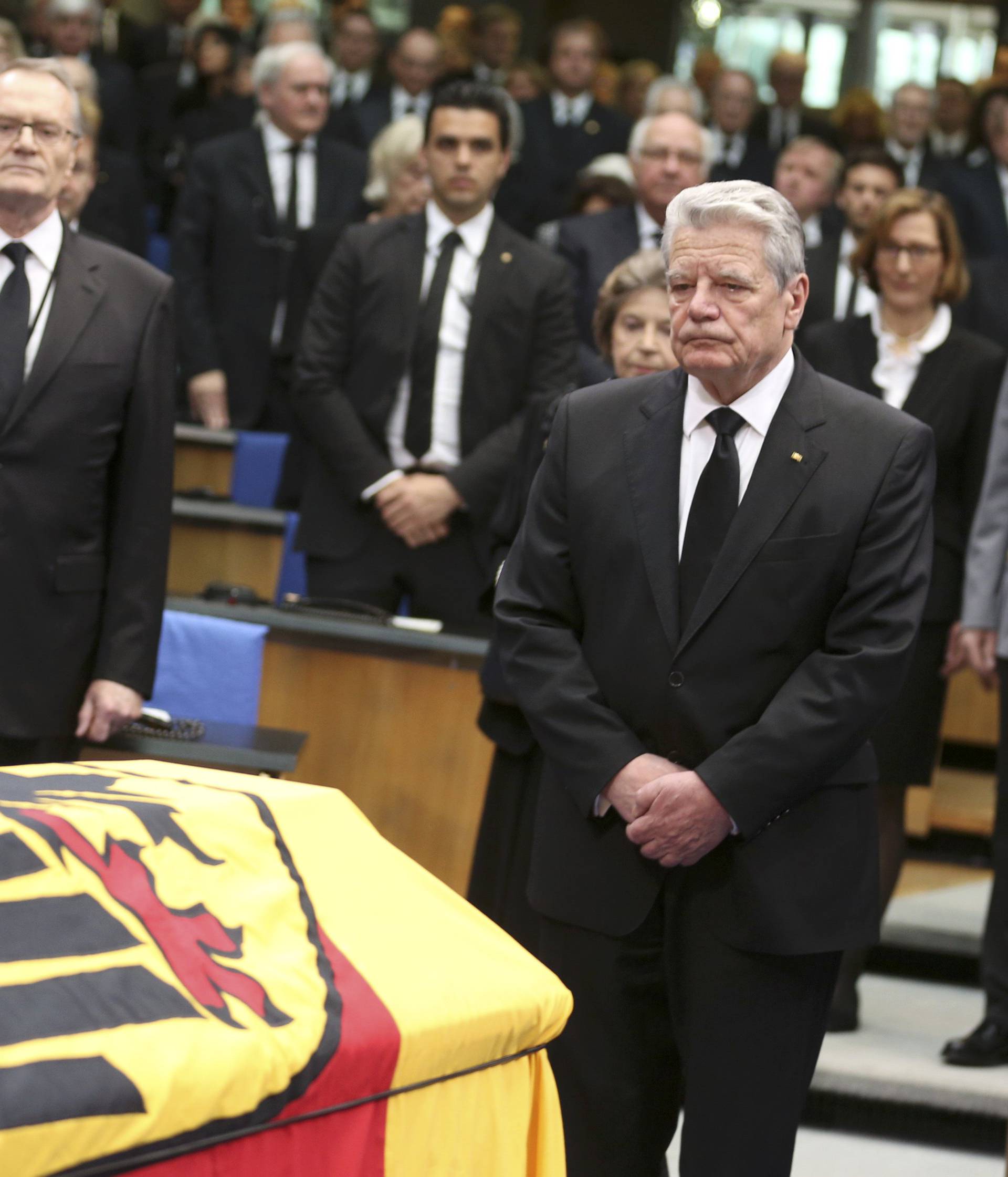 German President Gauck pays last respects during a memorial service for former West German foreign minister Hans-Dietrich Genscher in the former lower house of parliament Bundestag in Bonn