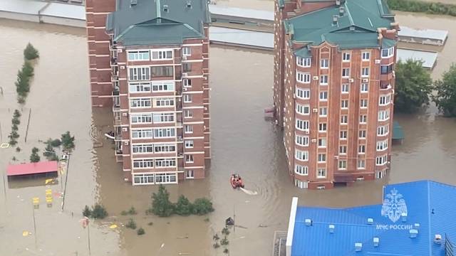 Rescuers use inflatable boats to evacuate residents of the flooded area in Ussuriysk