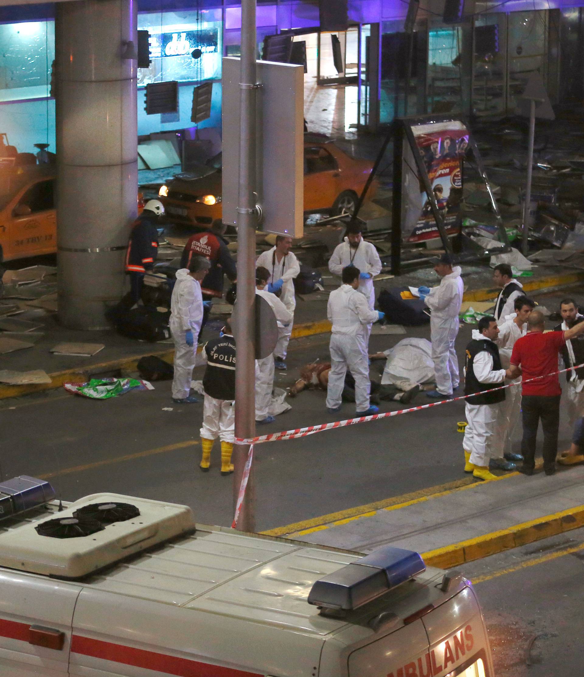 Forensic experts work outside Turkey's largest airport, Istanbul Ataturk, Turkey, following a blast