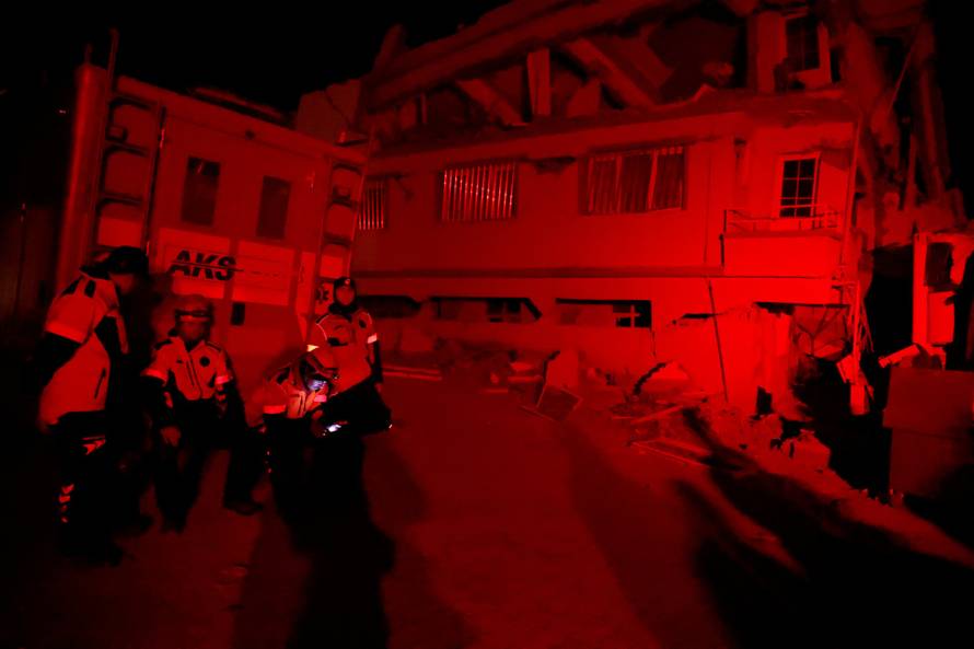 People react after a quake in Samandagi in Hatay province, Turkey