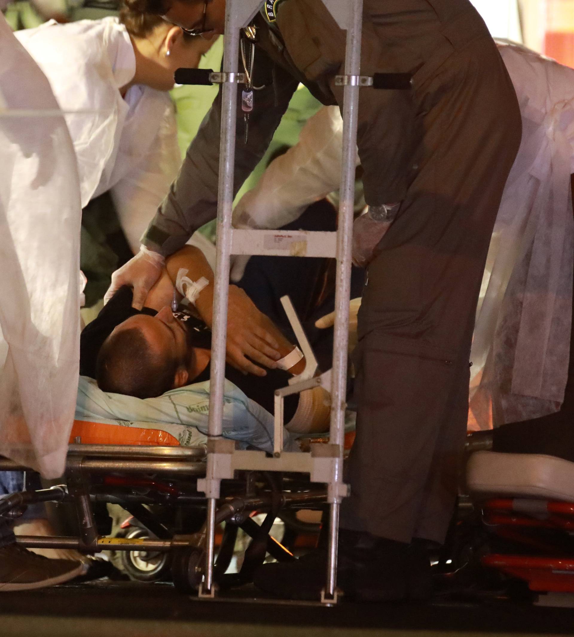 Ruschel, player of Brazilian soccer team Chapecoense, lies on a stretcher as he arrives to Brazil, after he survived a plane crash with his teammates aboard, in Chapeco