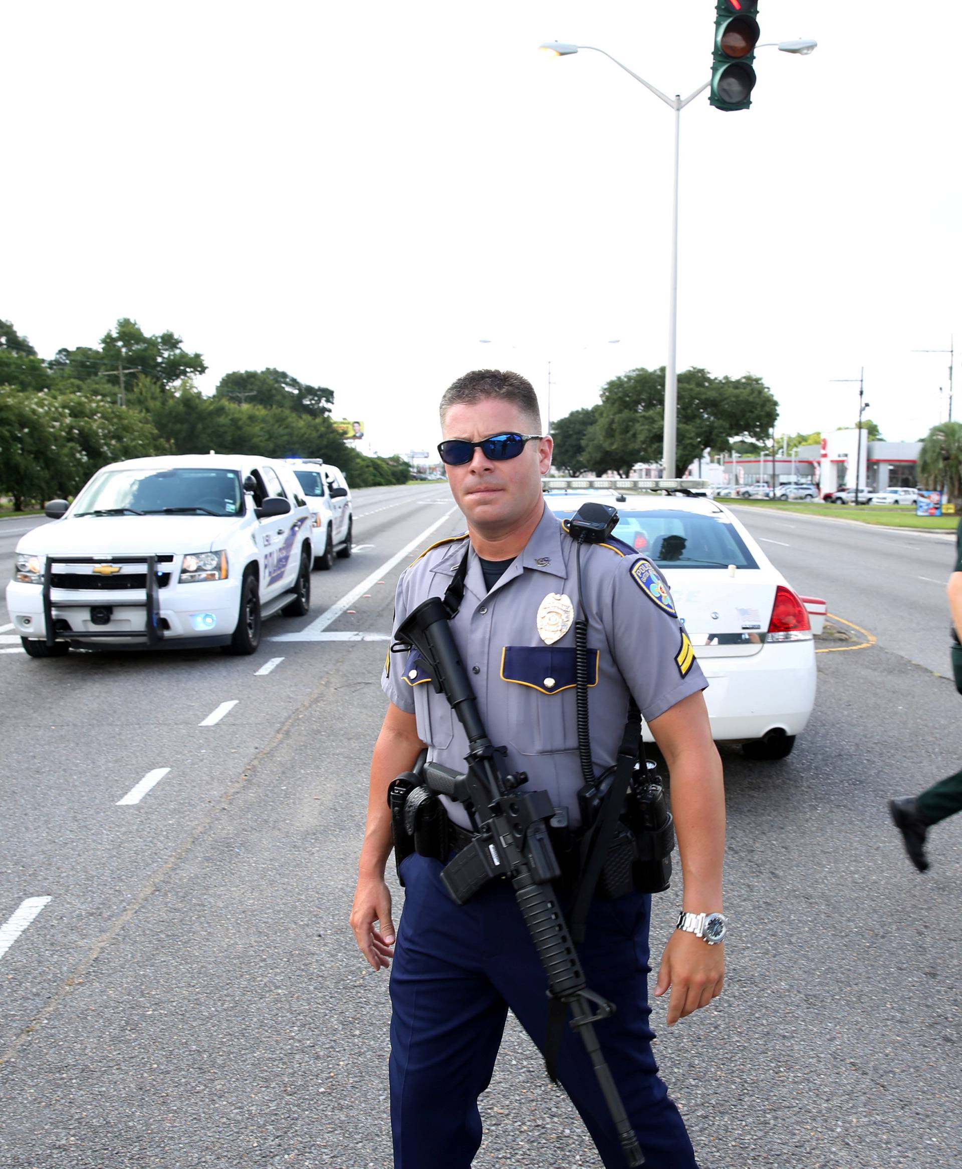 Police officers block off a road after a shooting of police in Baton Rouge