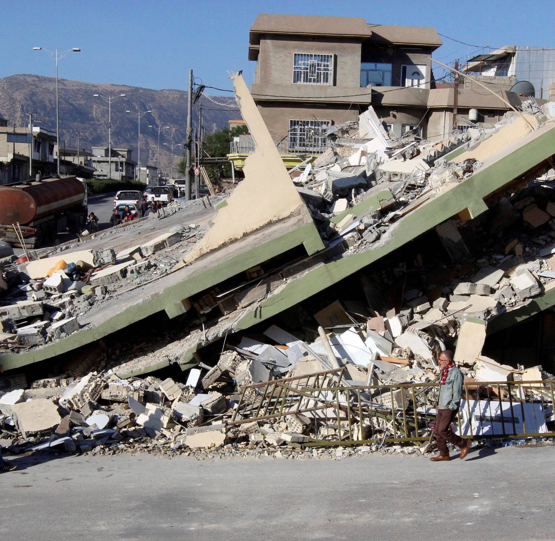 Collapsed building is seen in the town of Darbandikhan