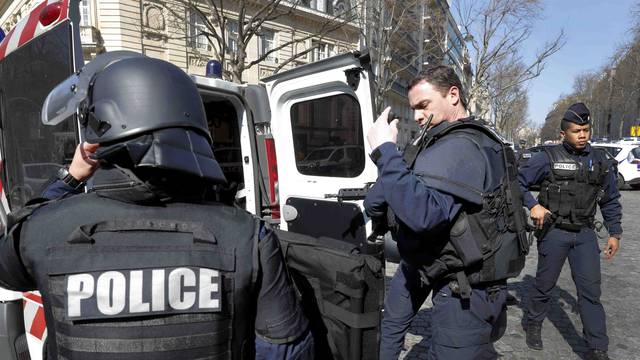 Police outside the International Monetary Fund offices where an envelope exploded in Paris