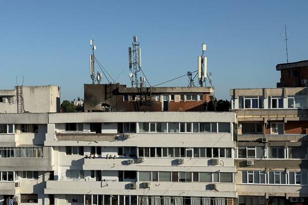 Firefighters and law enforcement work on the site of an explosion at a residential block of flats following a drone hit close to the border with Ukraine