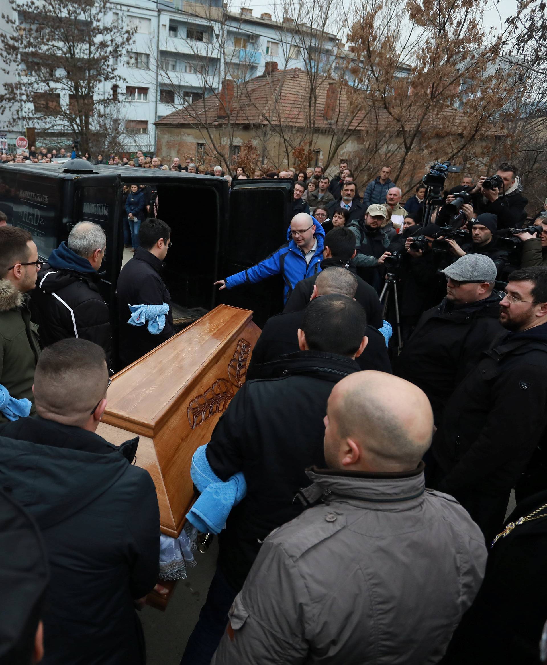 Men carry the coffin with the body of Oliver Ivanovic before a cortege travel to the northern outskirts of Kosovska Mitrovica