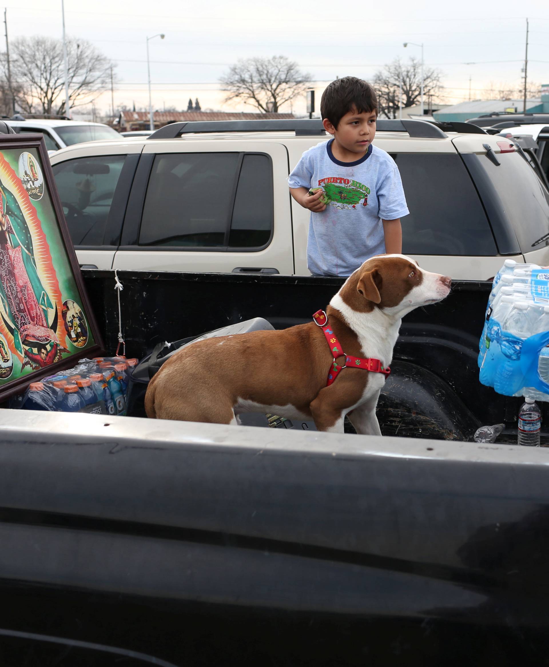 Richard Kelly, of Chico, distributes water at a Red Cross relief center in Chico, California, after an evacuation was ordered for communities downstream from the Lake Oroville Dam, in Oroville