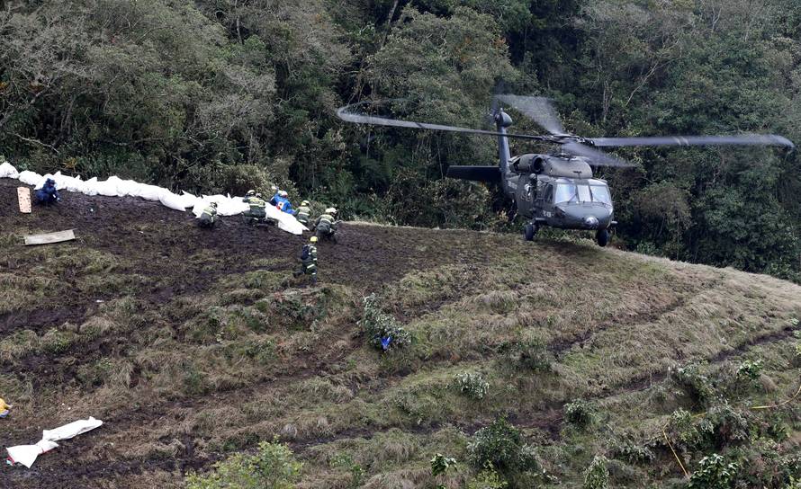 A Colombian air force helicopter arrives to retrieve the bodies of victims from the wreckage of a plane that crashed into the Colombian jungle with Brazilian soccer team Chapecoense onboard, near Medellin