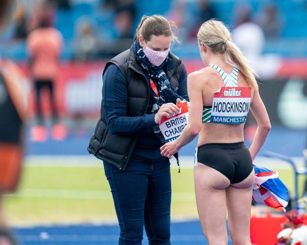 Manchester, UK. 27th June 2021. 27th June 2021; Manchester Regional Arena, Manchester, Lancashire, England; Muller British Athletics Championships; Keely Hodgkinson receives a new bib stating &#x2018; British Champion' after winning the 800m Credit: Actio