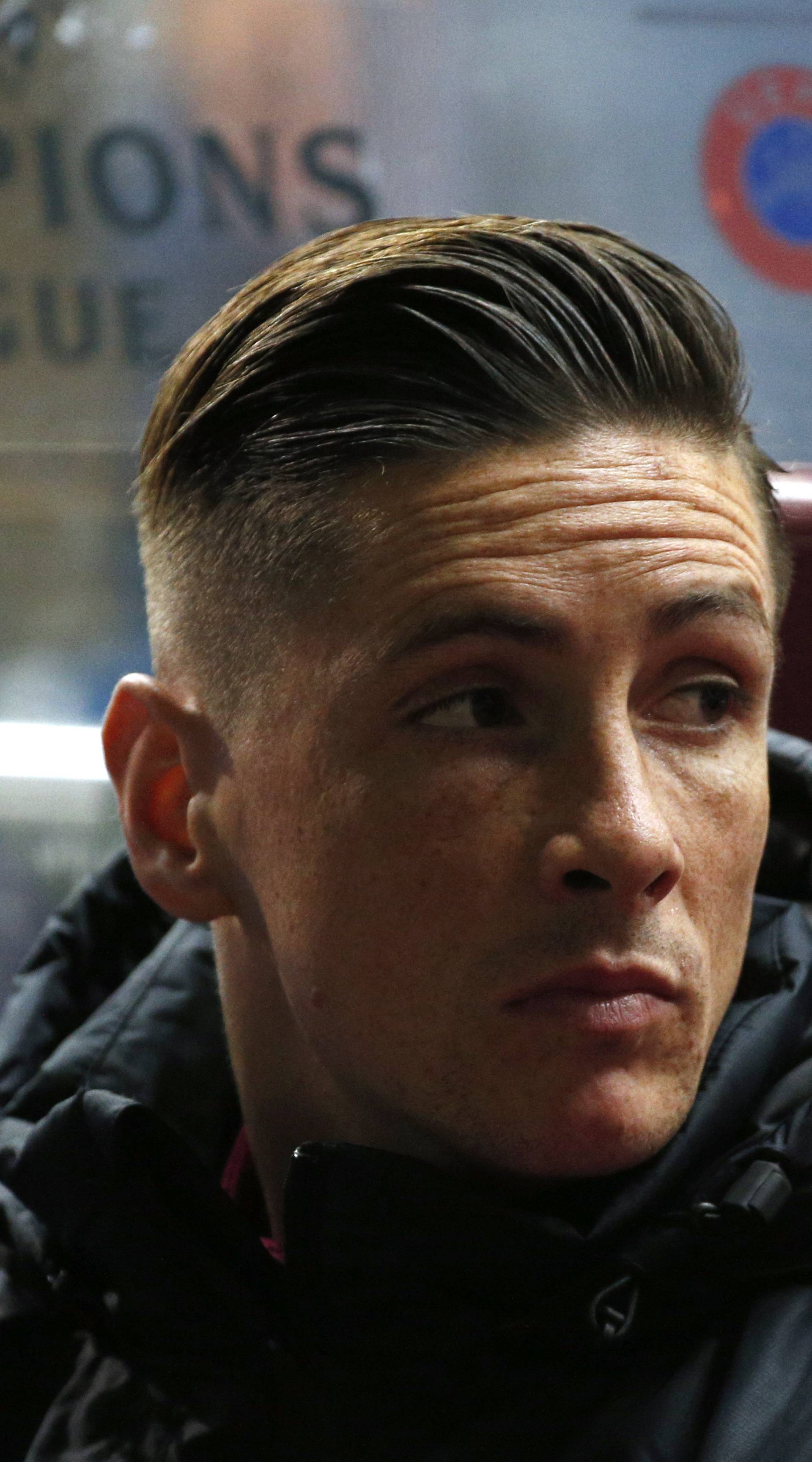 Atletico Madrid's Fernando Torres on the substitutes bench