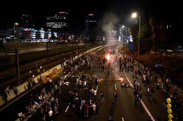 Israelis demonstrate after Israeli Prime Minister Benjamin Netanyahu sacked his defense minister, Yoav Gallant, citing lack of trust, in Tel Aviv