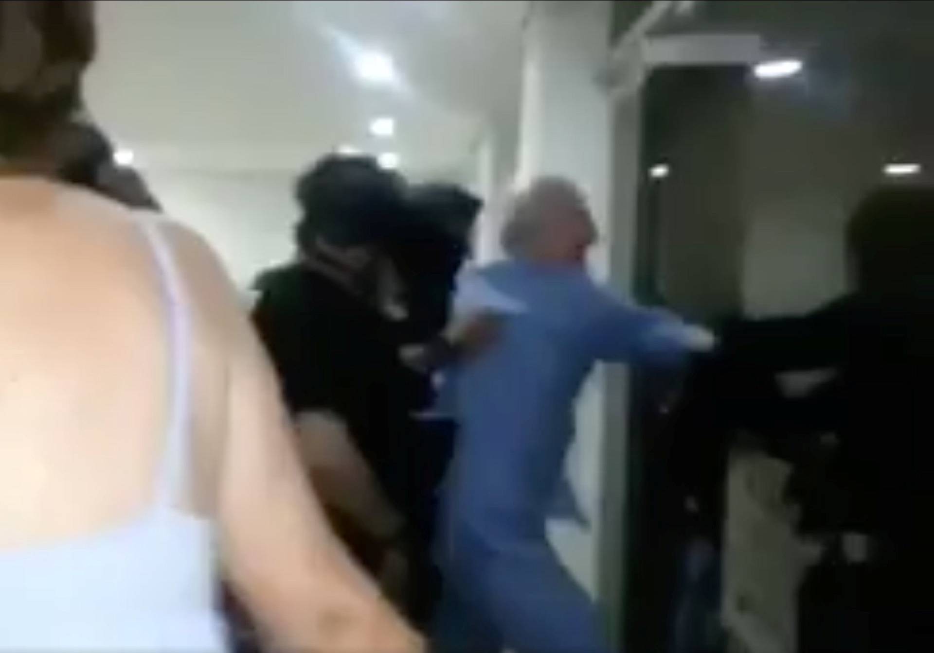 A still image taken from a social media video said to show the moment in which former Caracas Mayor Antonio Ledezma is led under arrest from his home, in Caracas