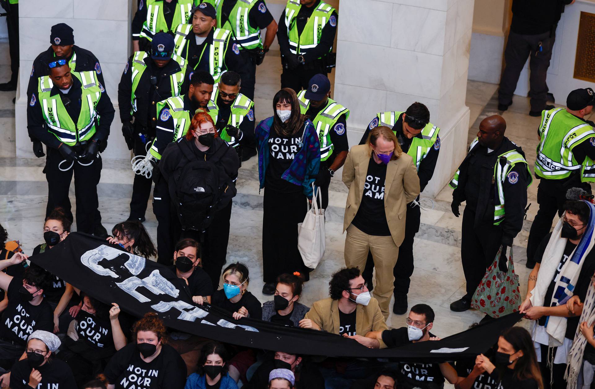 Protesters calling for a cease fire in Gaza occupy House office building rotunda on Capitol Hill in Washington