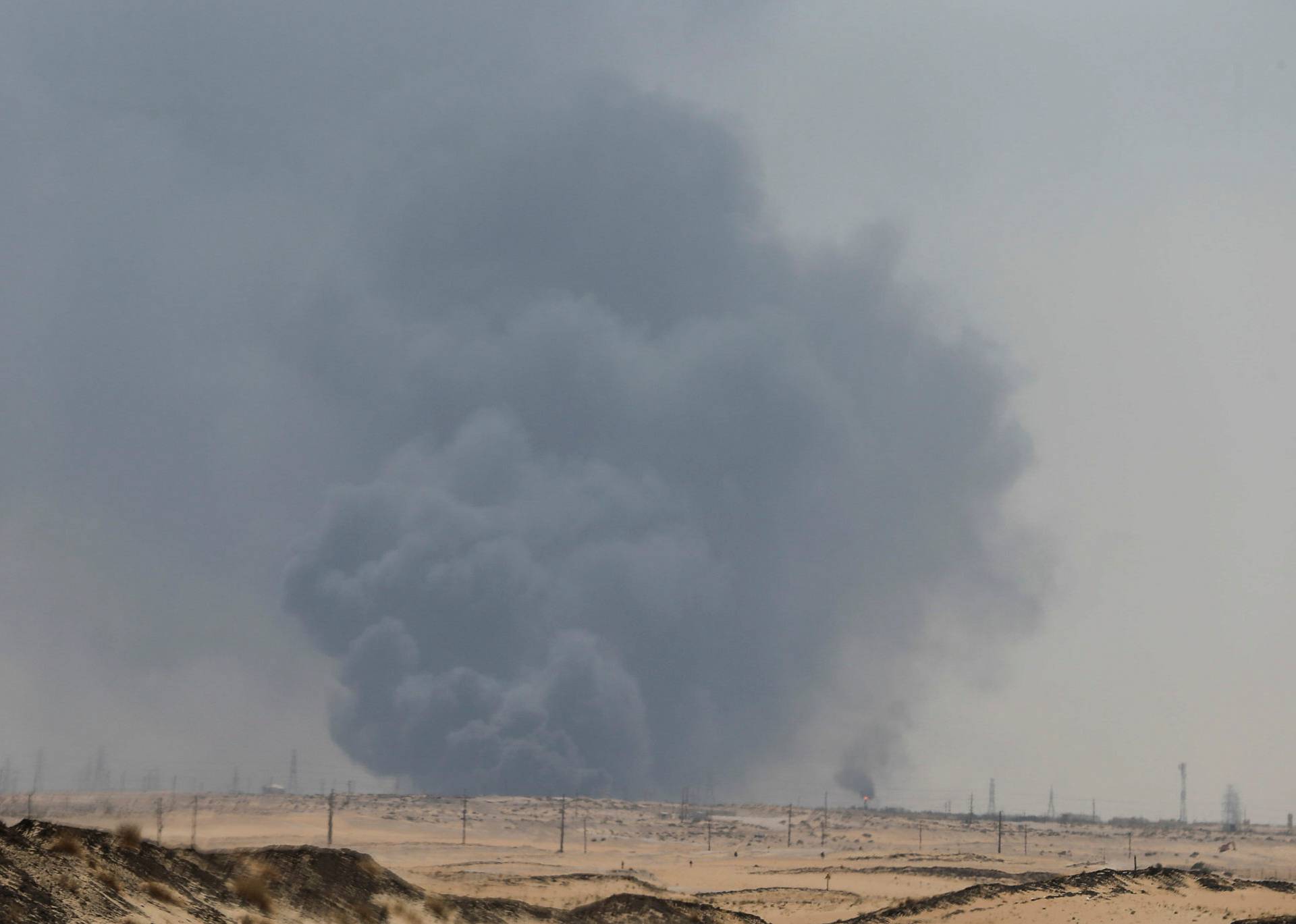 Smoke is seen following a fire at Aramco facility in the eastern city of Abqaiq