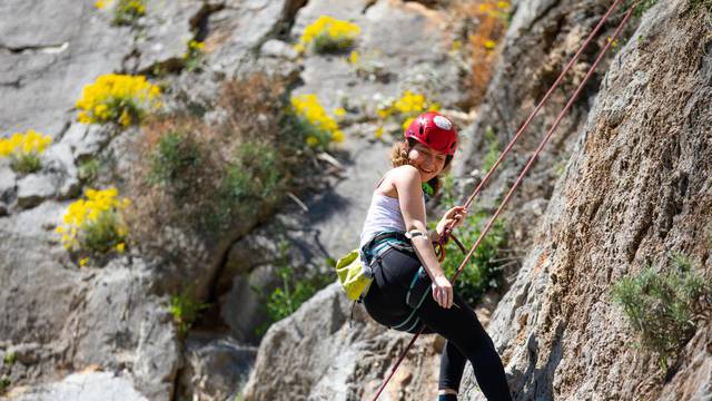 Female,Climber,Is,Climbing,The,Rock.
