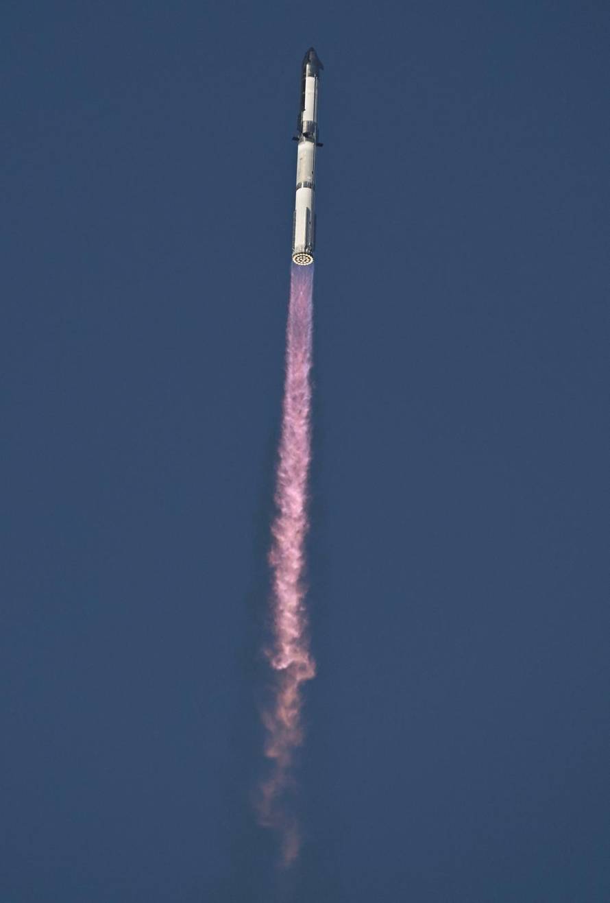 A SpaceX Super Heavy booster carrying the Starship spacecraft lifts off on its 10th test flight