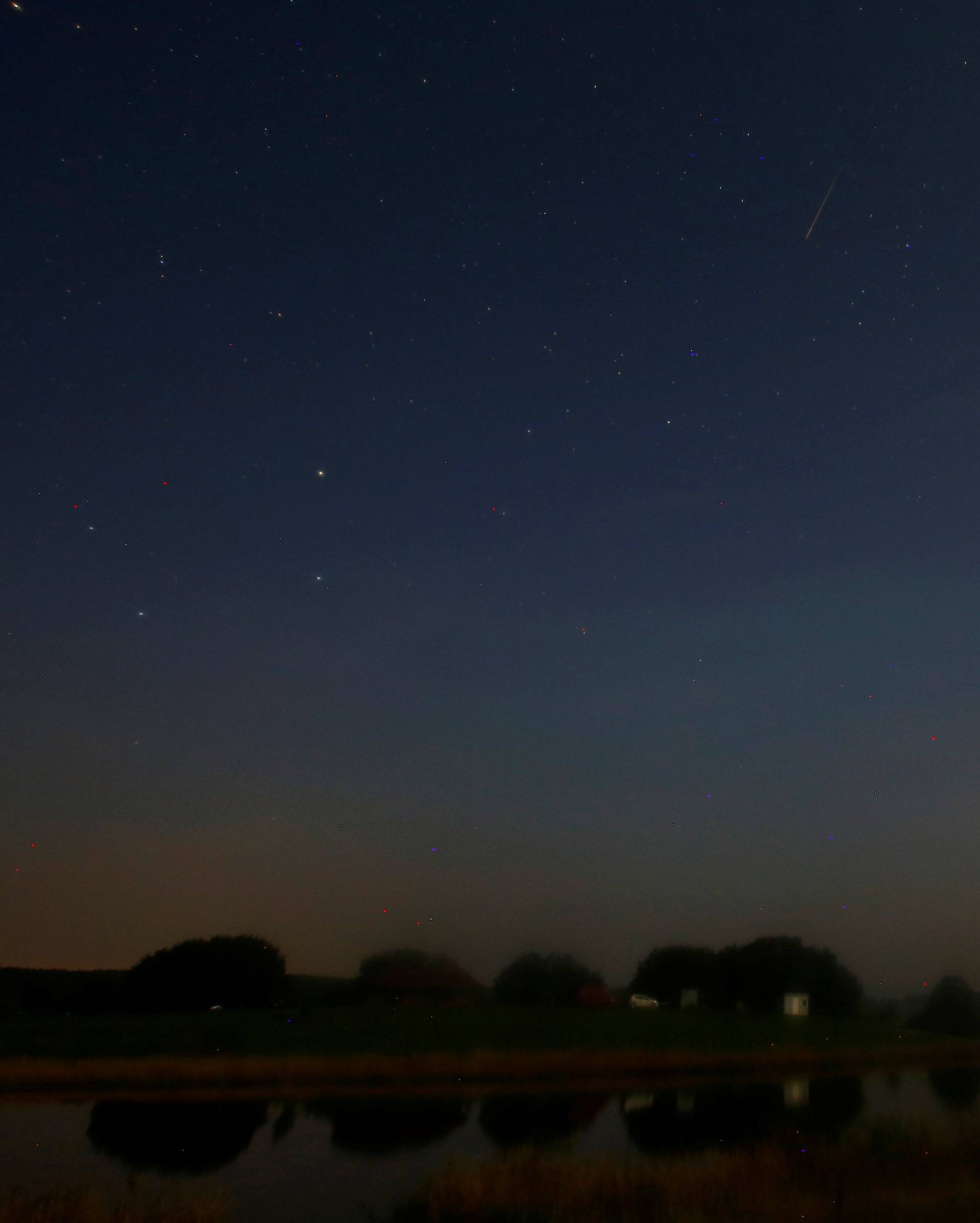 Meteor streaks past stars in the night sky during the annual Perseid meteor shower near the village of Prilepy