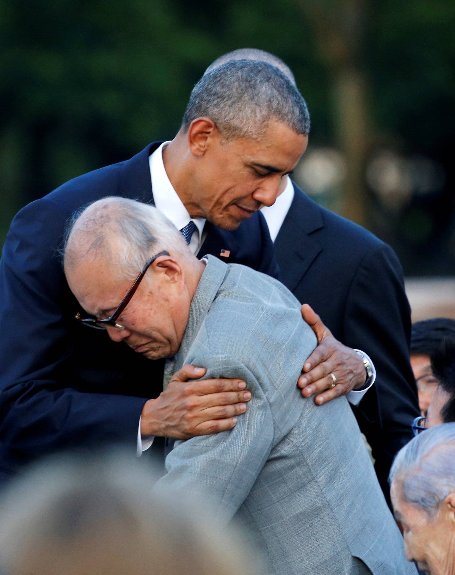 U.S. President Barack Obama hugs  atomic bomb survivor Mori as he visits Hiroshima Peace Memorial Park in Hiroshima, Japan