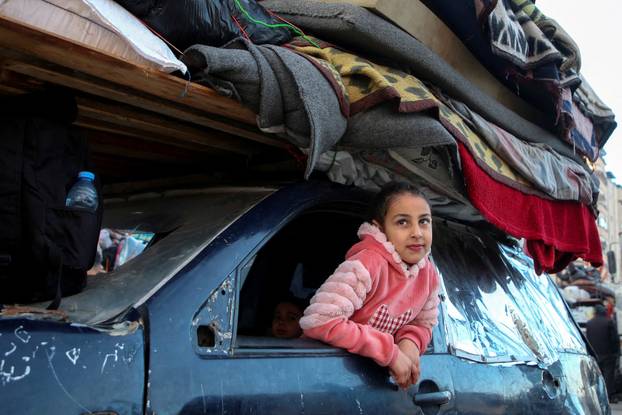 Displaced Palestinians wait to be allowed to return to their homes in northern Gaza, in the central Gaza Strip