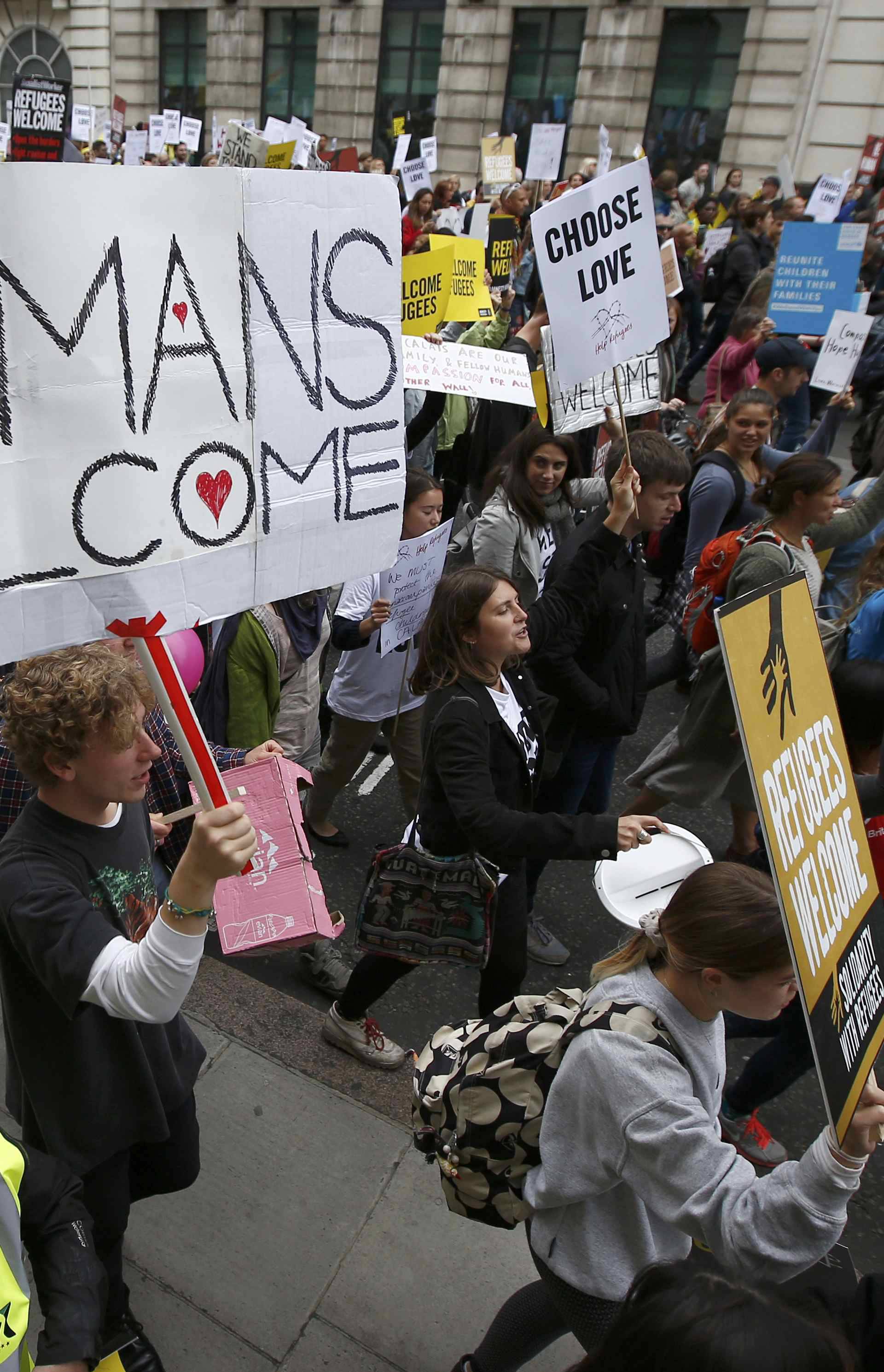 Demonstrators including refugees march to the Houses of Parliament during a protest in support of refugees, in London