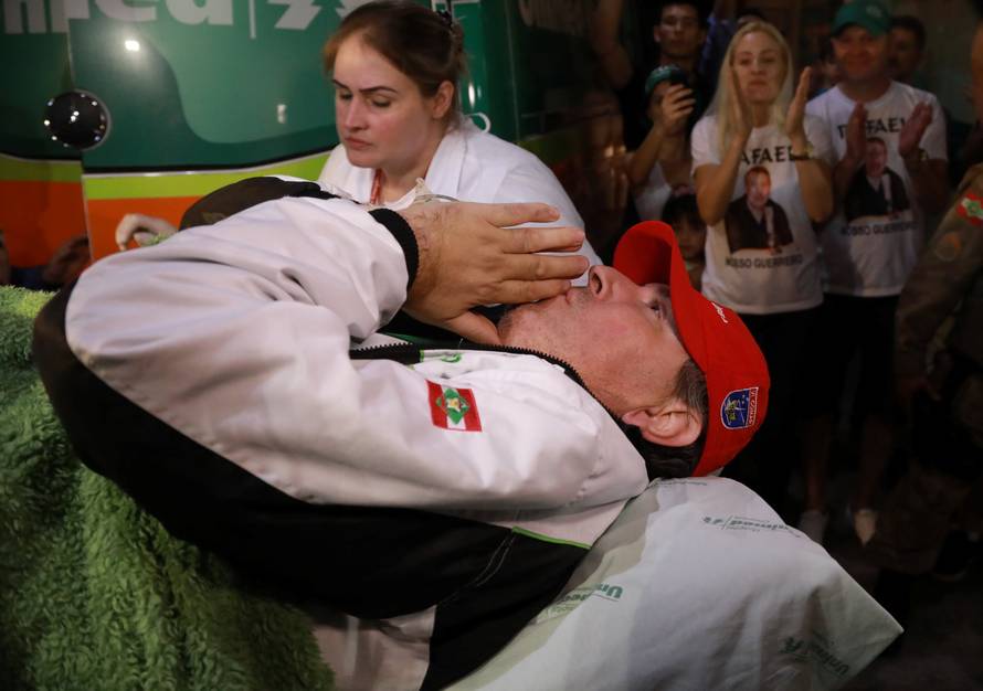 Brazilian radio journalist Rafael Henzel, lies on a stretcher as he arrives at the hospital in Brazil, after he survived a plane crash with Brazilian soccer team Chapecoense aboard, in Chapeco