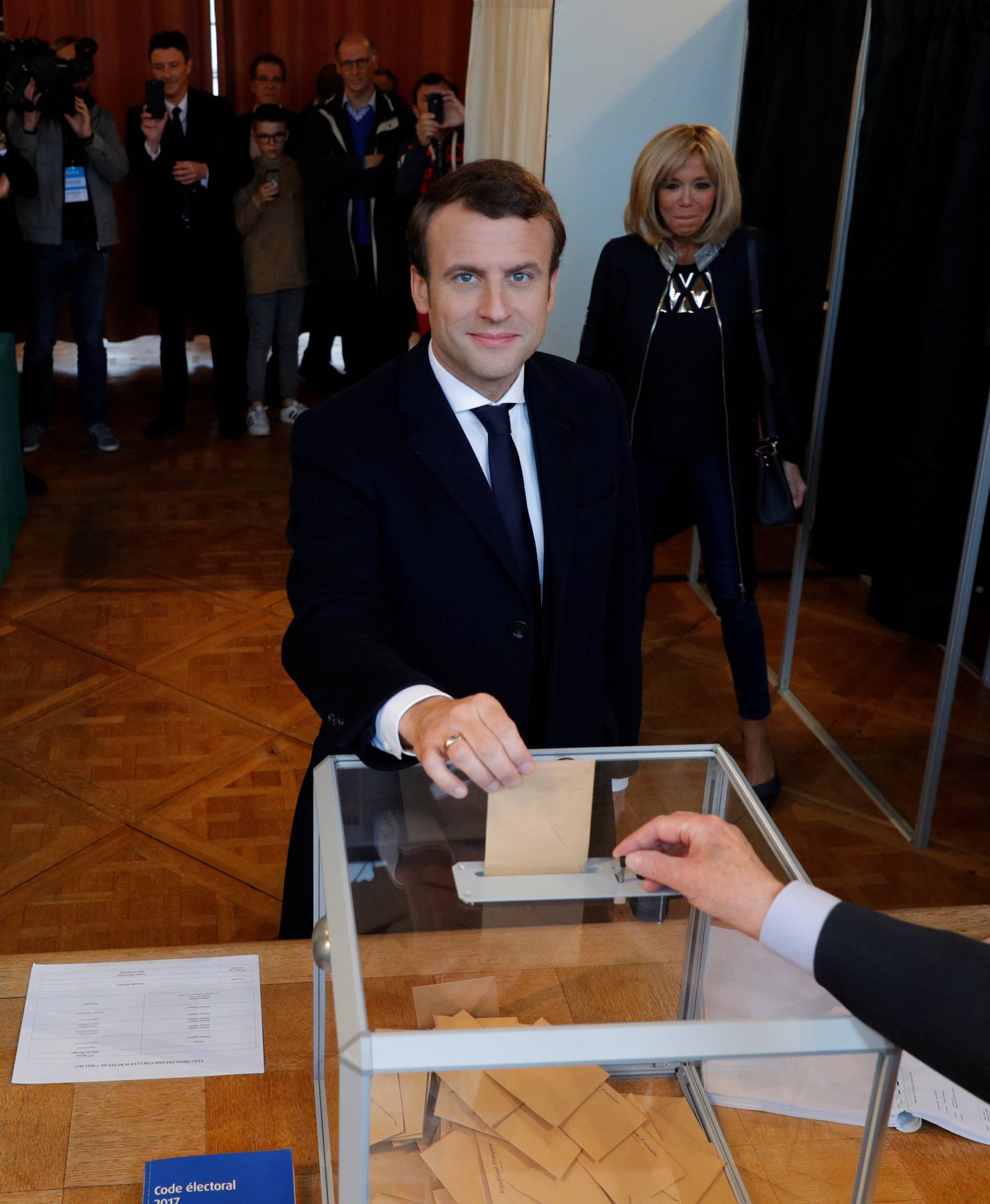 French presidential election candidate Emmanuel Macron, head of the political movement En Marche !, or Onwards ! casts his ballot at a polling station during the the second round of 2017 French presidential election, in Le Touquet,