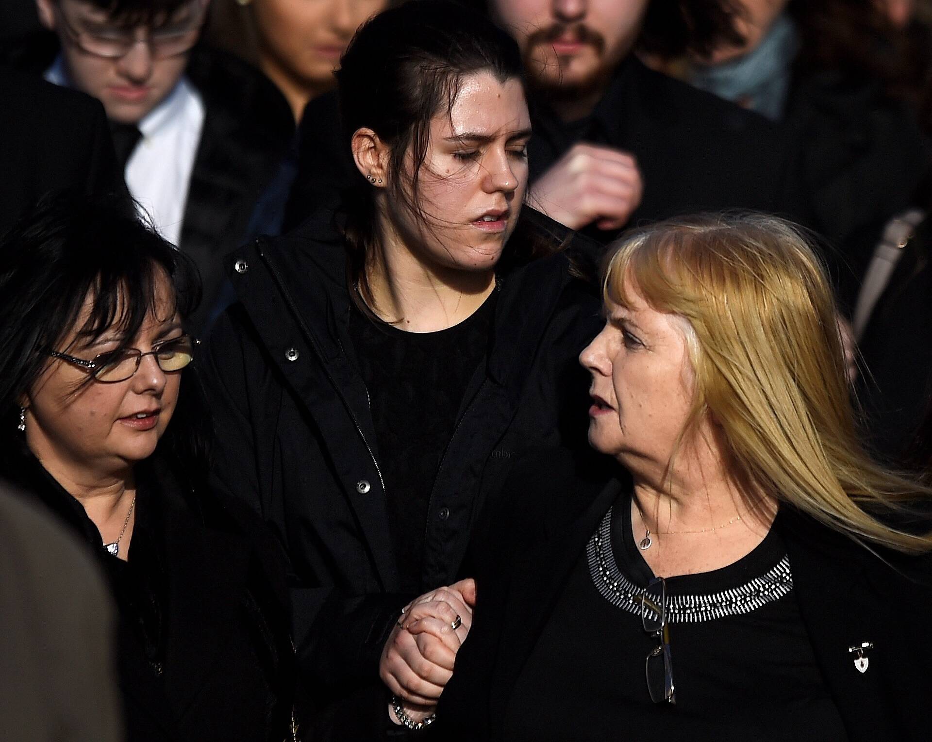 Eillen O'Riordan leaves her daughter Dolores O'Riordan's funeral with one of Dolores' daughters and Dolores' sister Angela at St Ailbe's Church in Ballybricken