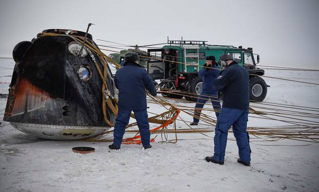 Search and rescue teams work at the site of the landing of the Soyuz MS-06 space capsule with International Space Station crew members in a remote area outside the town of Dzhezkazgan (Zhezkazgan), Kazakhstan