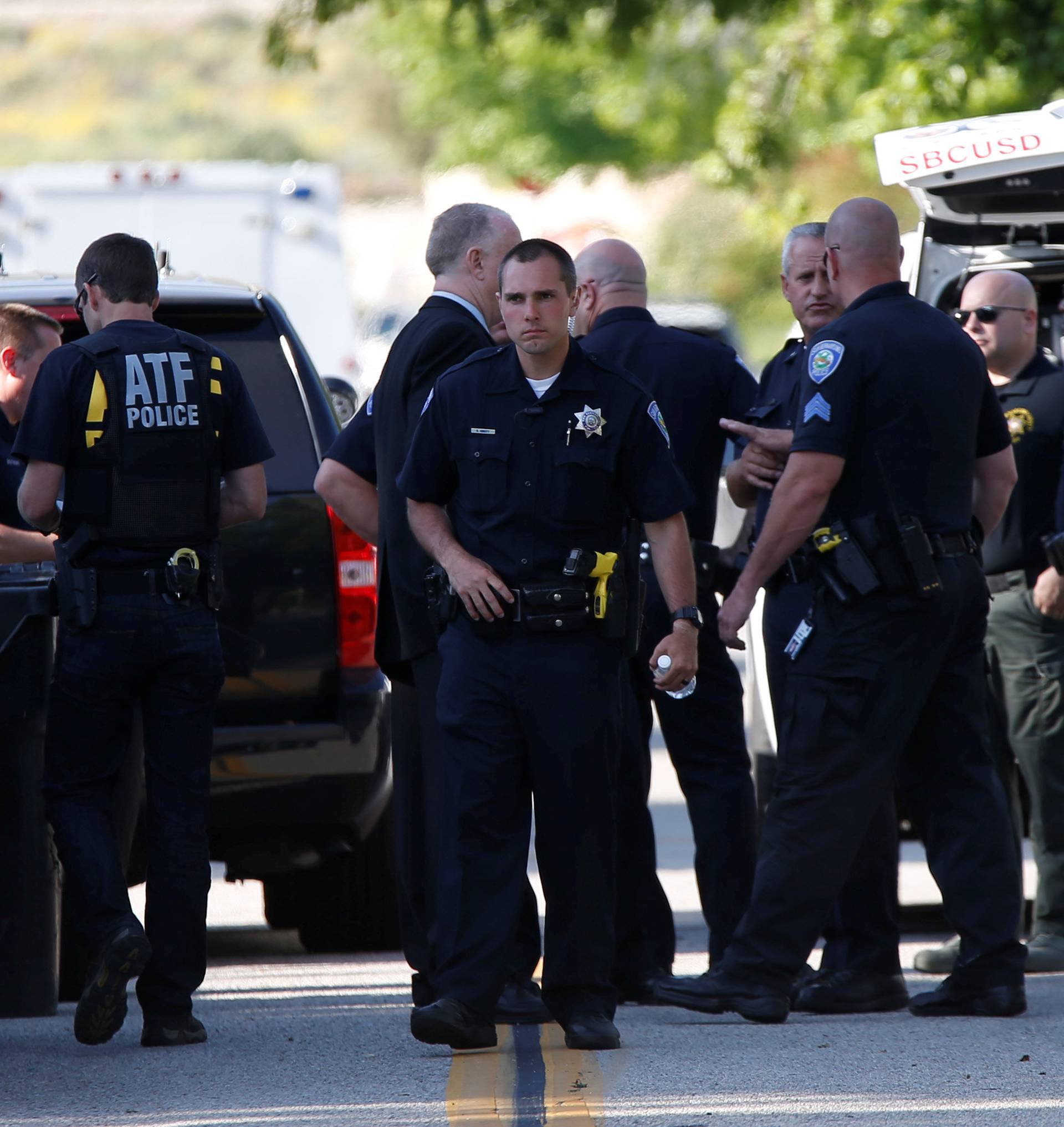 Police officers are pictured after a shooting at North Park Elementary School in San Bernardino
