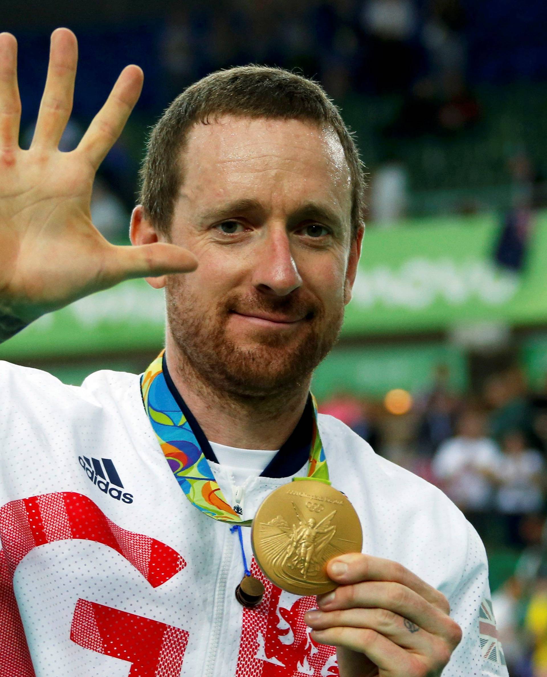 FILE PHOTO: Bradley Wiggins (GBR) of Britain poses with his gold medal at the Men's Team Pursuit Victory Ceremony