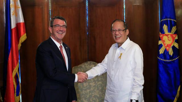 President of the Philippines Benigno Aquino greets visiting U.S. Defense Secretary Ash Carter at the presidential palace in Manila