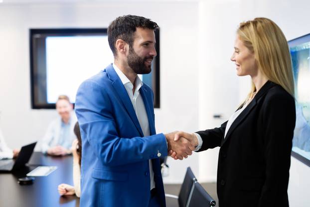 Portrait of business couple in conference room