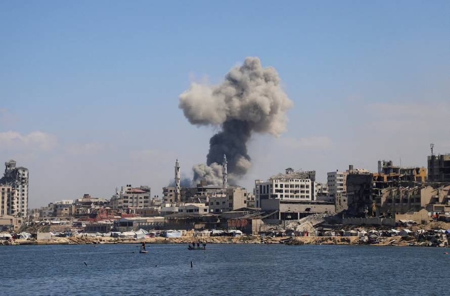 Smoke rises following Israeli strikes during a military operation, in Gaza City