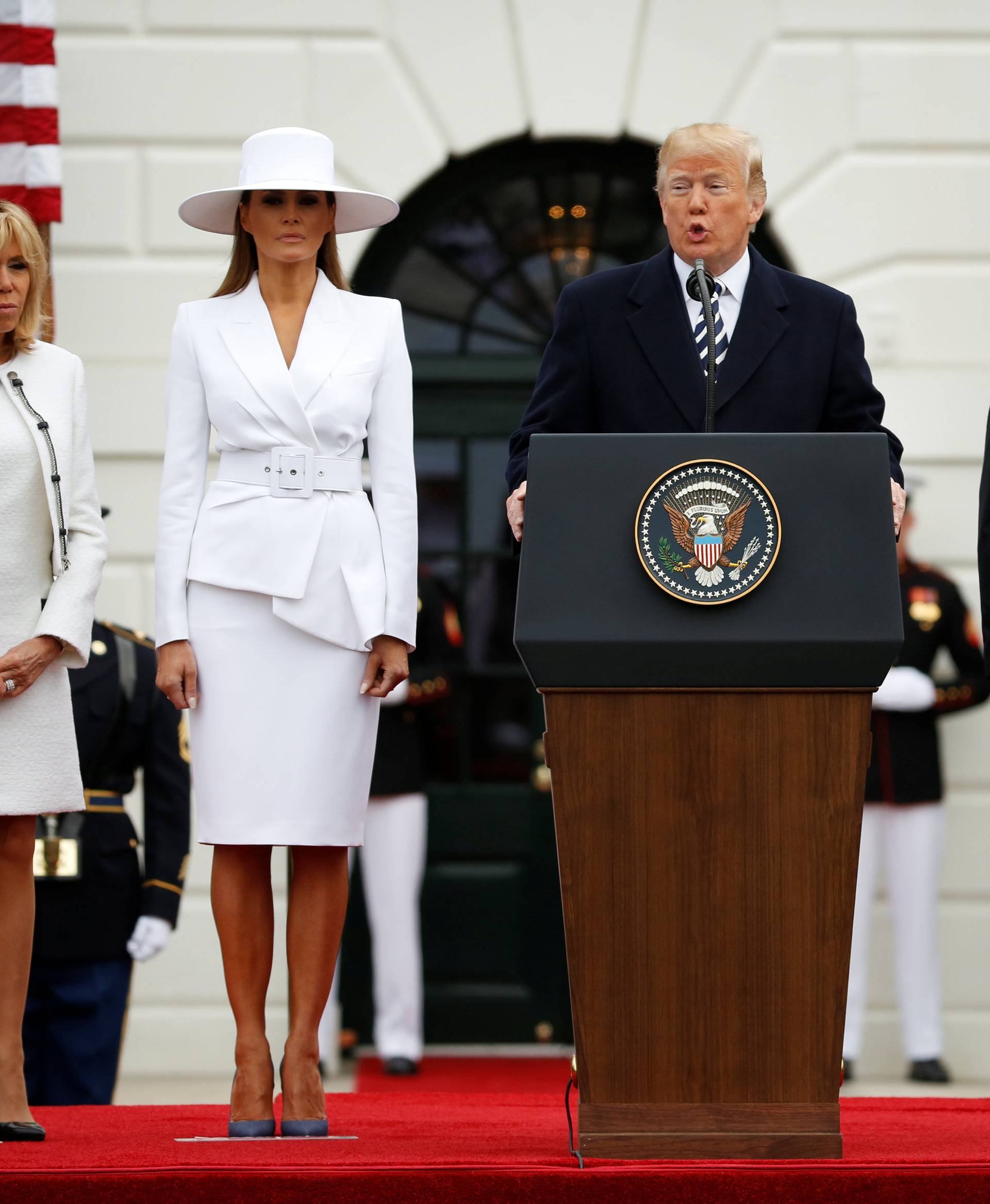 U.S. President Donald Trump and first lady Melania Trump welcome French President Emmanuel Macron and his wife Brigitte Macron during an arrival ceremony at the White House in Washington