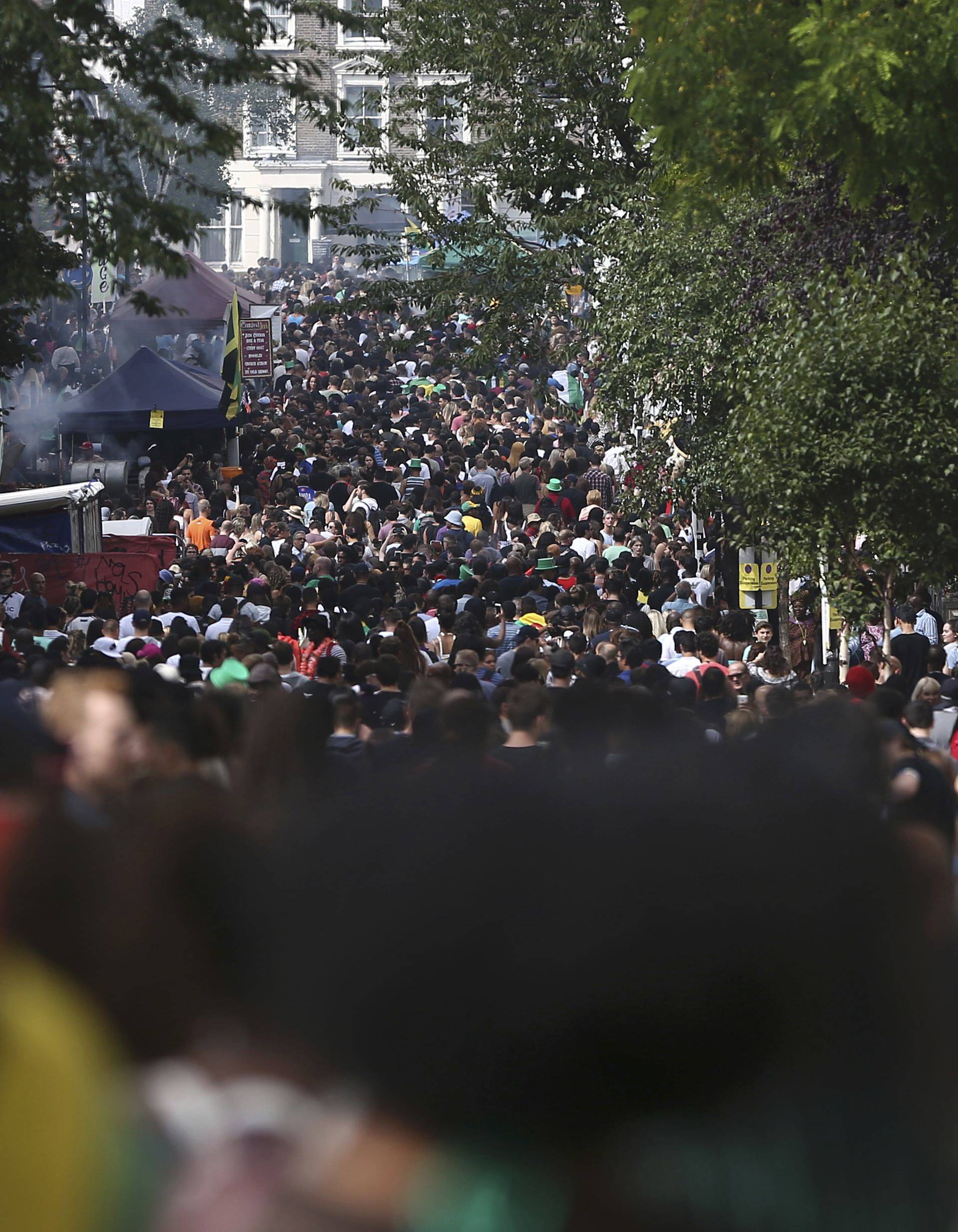 Crowds line the streets during the Notting Hill Carnival in London