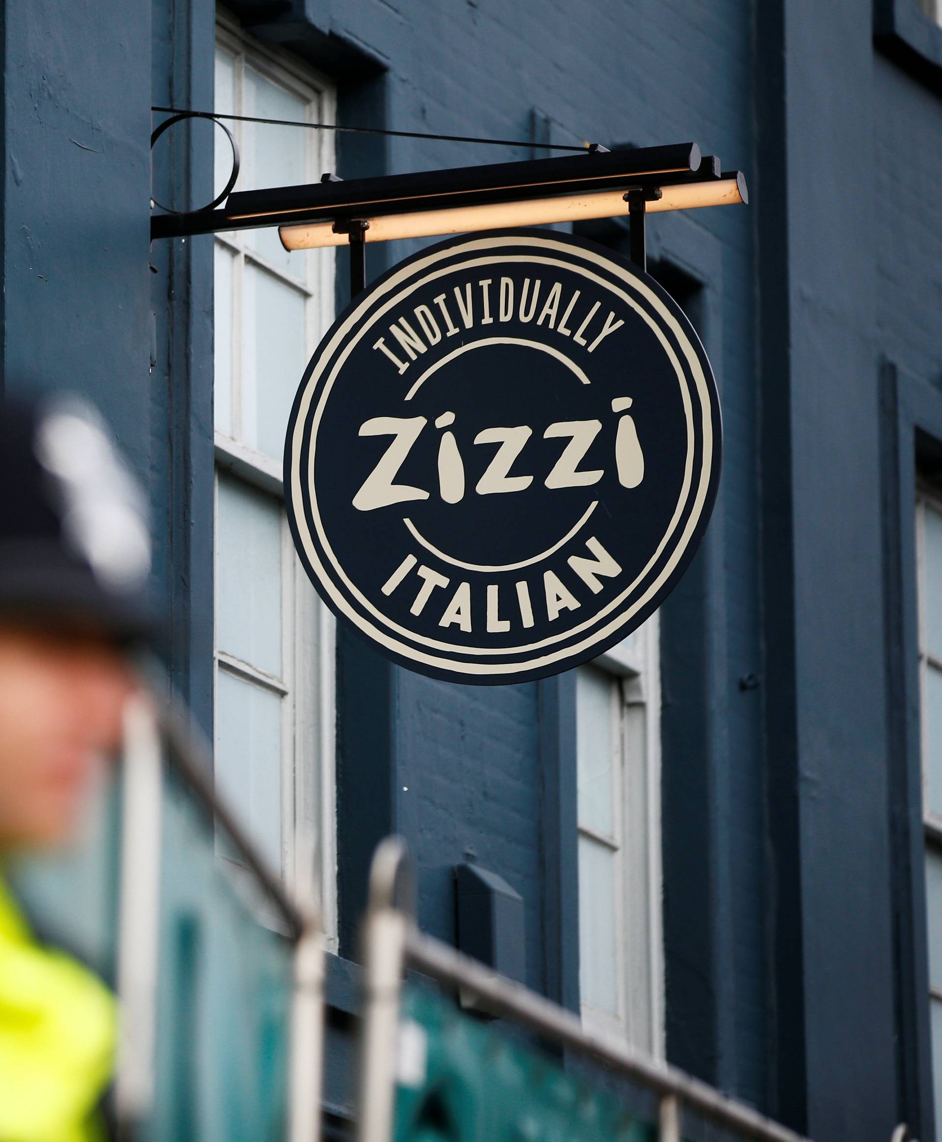 Police officers stand on duty outside a restaurant which has been secured as part of the investigation into the poisoning of former Russian inteligence agent Sergei Skripal and his daughter Yulia, in Salisbury
