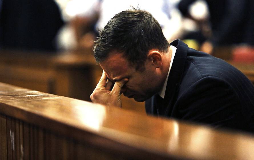 FILE PHOTO: Olympic and Paralympic track star Pistorius reacts as Judge Masipa delivers her verdict at the North Gauteng High Court in Pretoria