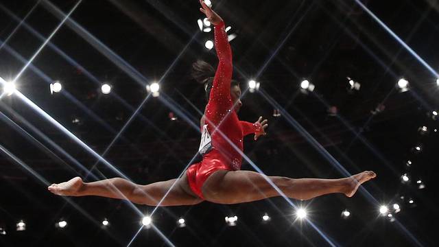 Simone Biles of the U.S competes on the beam during the women's all-round final at the World Gymnastics Championships in Glasgow