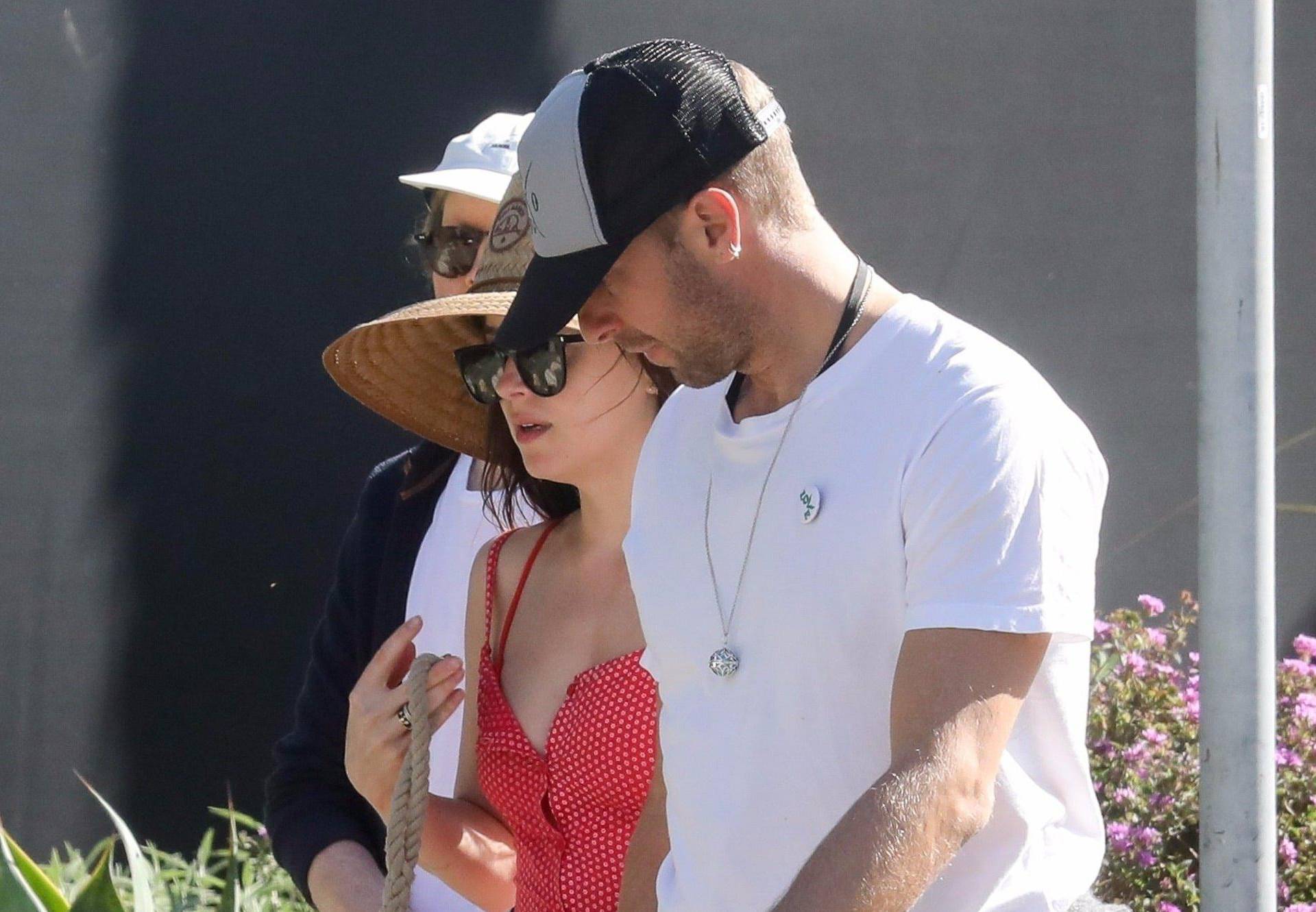 *EXCLUSIVE* Chris Martin and Dakota Johnson barefoot in the park with pup