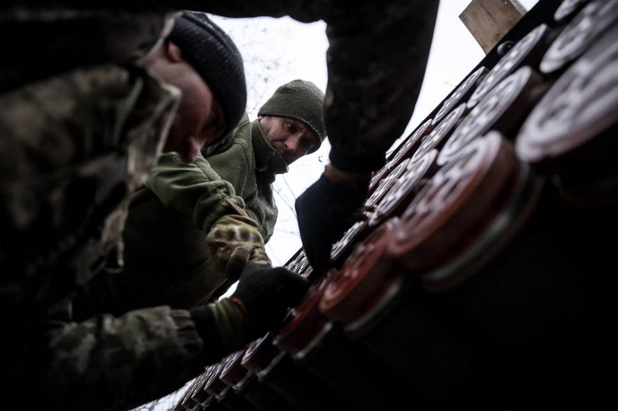 Ukrainian servicemen fire a Grad MLRS towards Russian troops near the frontline town of Chasiv Yar