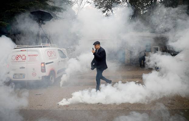 Protesters attack the headquarters of the Democratic Party in Tirana