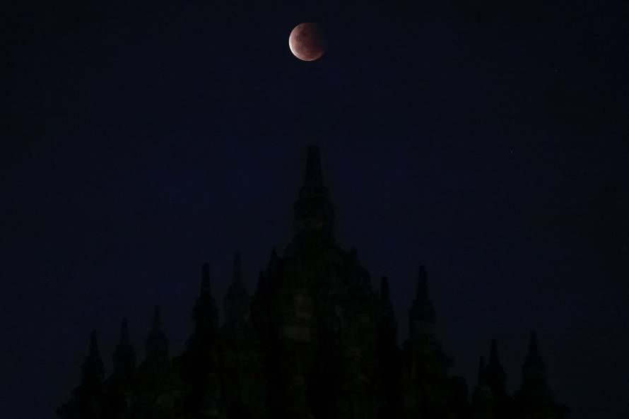 A Super Blood Moon rises over the Plaosan temple during total lunar eclipse in Klaten