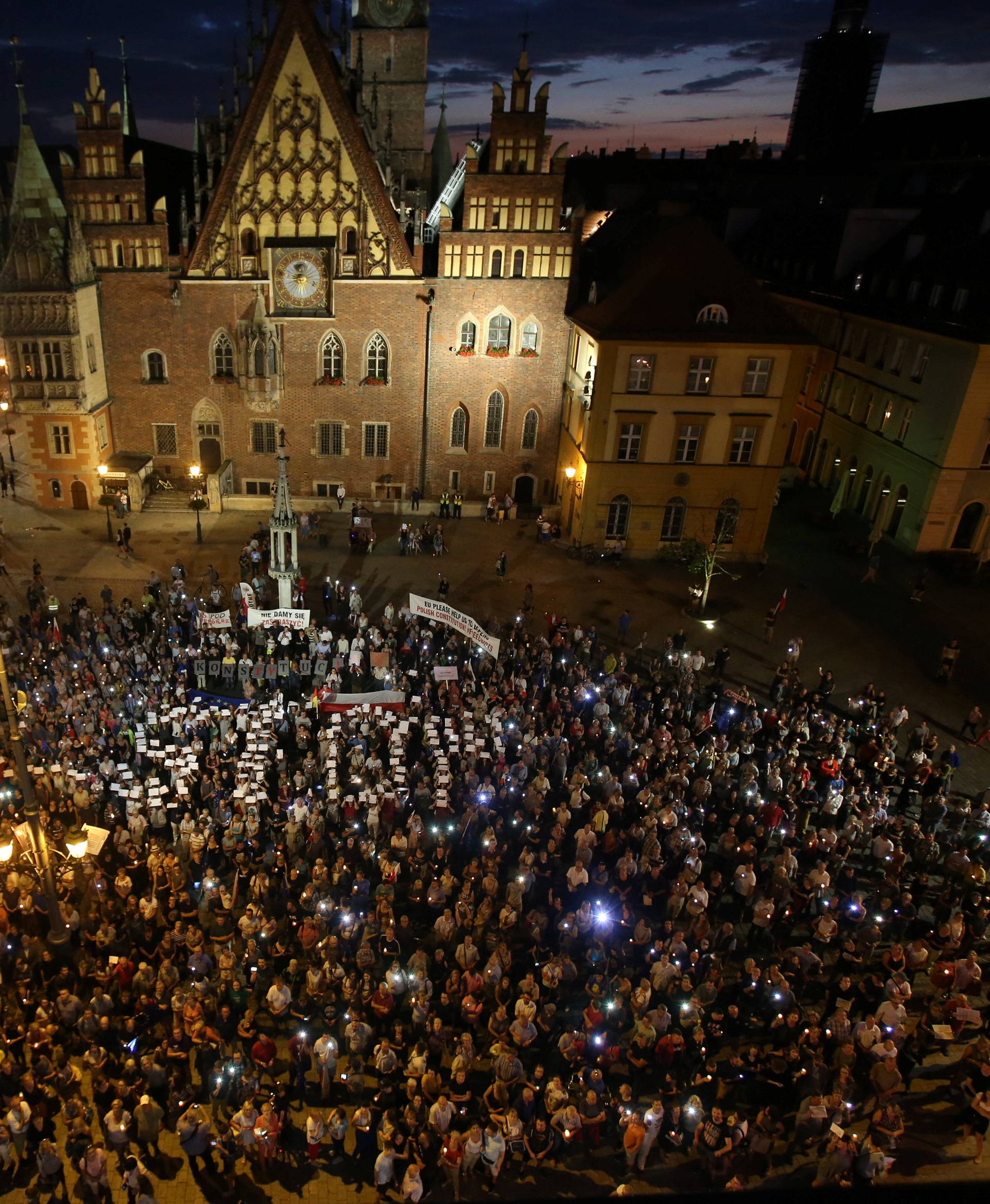 People attend a protest against judicial overhaul in Wroclaw