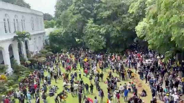 Demonstrators protest inside the President's House, after President Gotabaya Rajapaksa fled, in Colombo