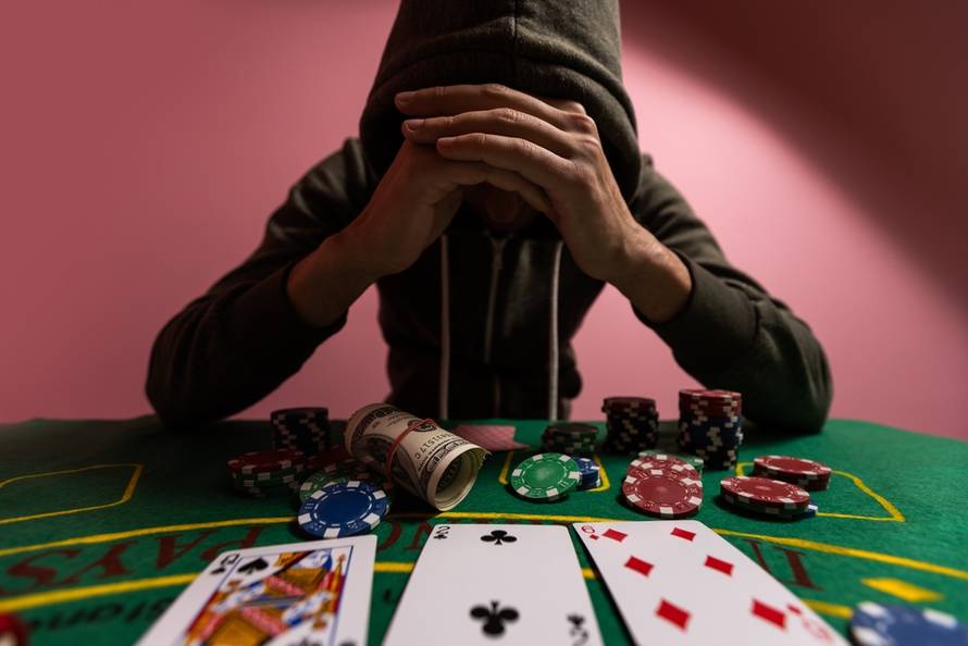 Devastated,Gambler,Man,Losing,A,Lot,Of,Money,Playing,Poker