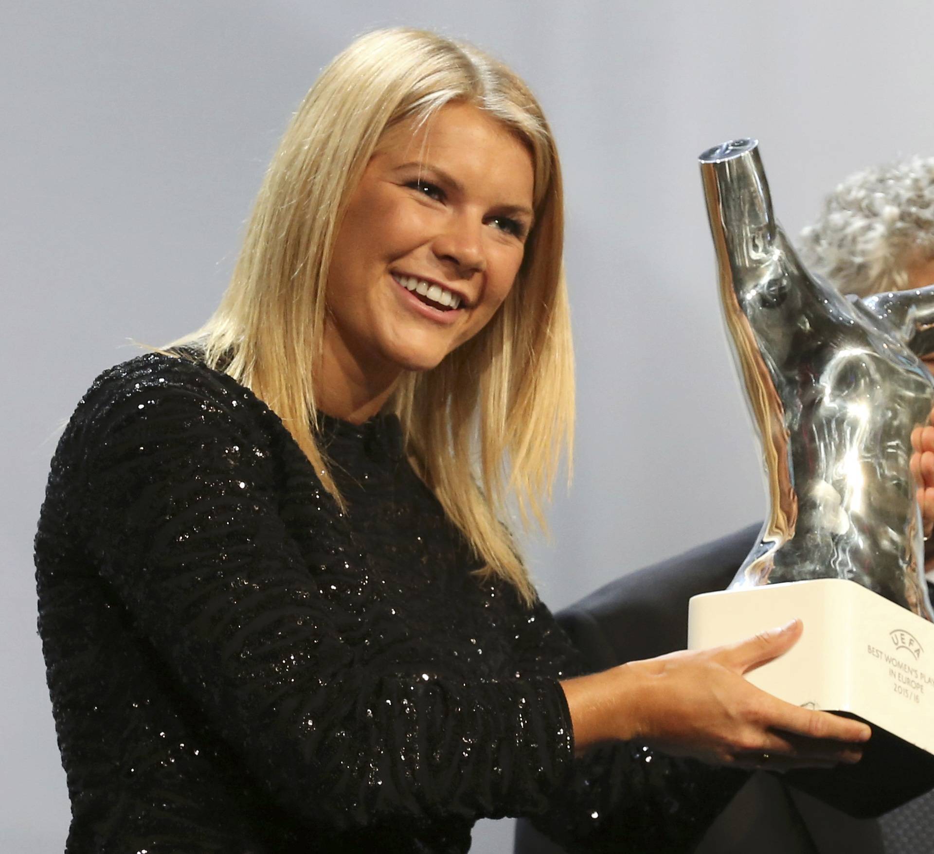 Olympique Lyon's Ada Hegerberg of Norway receives from UEFA President Angel Maria Villar the Best Player UEFA 2015/16 Award during the draw ceremony for the 2016/2017 Champions League Cup soccer competition at Monaco's Grimaldi in Monaco