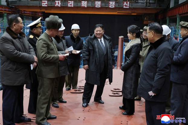 North Korean leader Kim Jong Un visits the construction site of an 8,700-ton nuclear-powered submarine