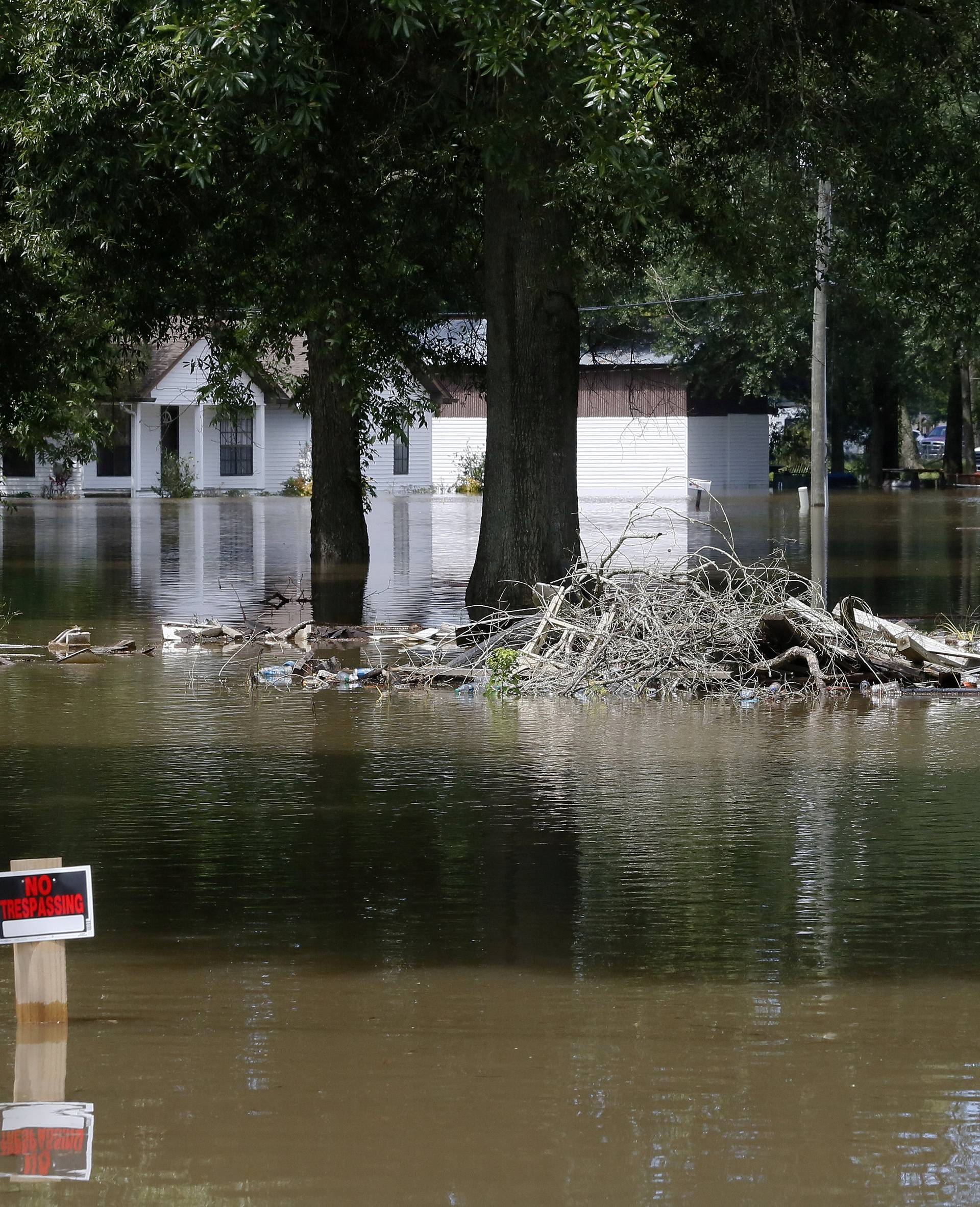 Flooded homes are seen in St. Amant