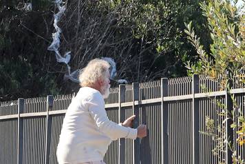 *EXCLUSIVE* Nick Nolte climbs a fence in his PJ's in Malibu