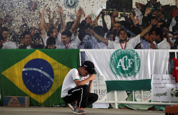 A young fan of Chapecoense soccer team pays tribute to Chapecoense